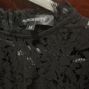 Black sleeveless lace dress   Falls right above knee